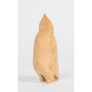 A carved whale's tooth penguin statue, North American, Inuit.…