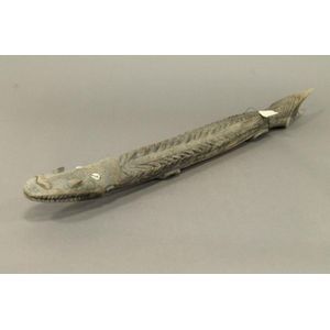 A Melanesian wood crocodile carving of long stylised carved…