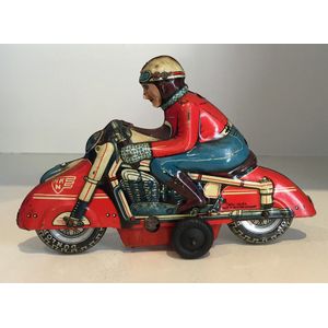 A tin racing motorcyclist friction toy by Huki-Keinberger, made…