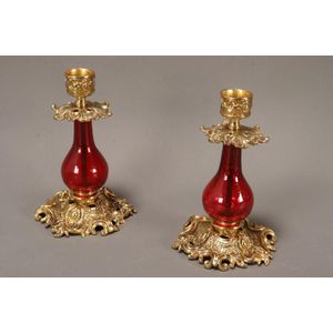 Pair of ruby glass and gilt metal candlesticks, of squat form,…