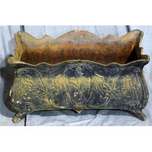 A decorative cast iron planter with draped foliage motifs 30 cm…