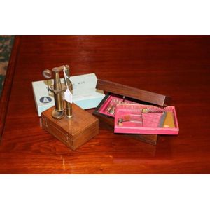 Antique 19th century microscope mounted on box, along with a…