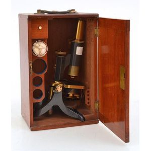 A monocular microscope, swift & Son, London, on black lacquered…