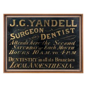 A reverse glass shop sign 'J.G. Yandell Surgeon Dentist,…