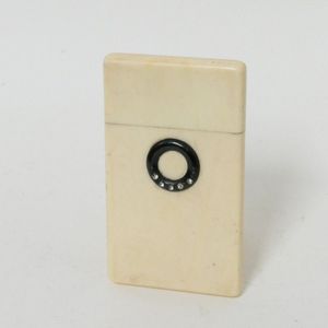 A small plain ivory card case, set with a small inlaid ring of…