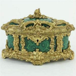 Ormolu jewellery casket with ornate designs framing marble…