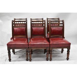 A set of six Edwardian walnut dining chairs