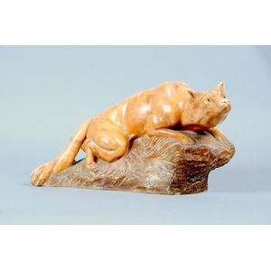 A finely detailed French marble figure of a crouching fox,…