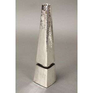 Israeli hand beaten silver candlestick, of facetted tapering…