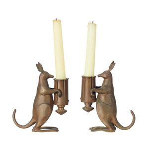 A pair of bronze candlesticks in the form of kangaroos, each…