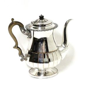 An Old Sheffield Plate coffee pot, baluster with lower faceted…