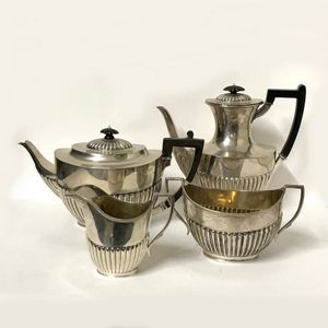 A four-piece Georgian Revival tea and coffee service, the ovoid…