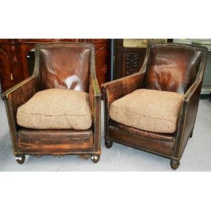 A pair of French Art Deco period leather armchairs, with…