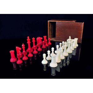 A Staunton design ivory chess set, c.1900, likely English, red…