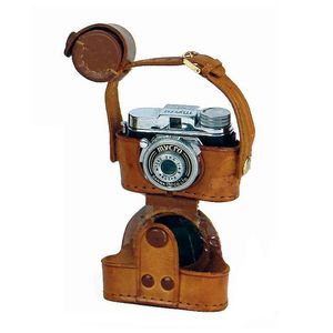 A miniature camera, in original leather case with an extra lens…