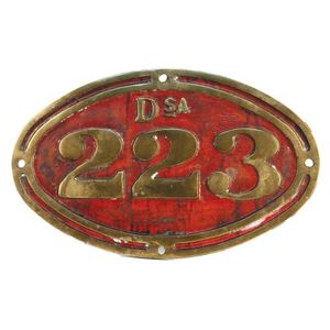 An NZR bronze railway engine number plate 'DSA 223', oval form…