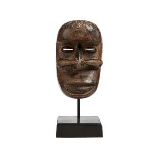 Bete mask the forward face shadowed with a large, domed…