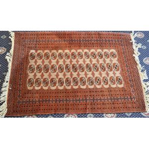 A Bokhara design rug 182 x 127 cm