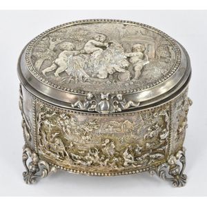 An antique French silver plated jewellery casket, raised on…