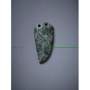 An unusual pounamu pendant, Teardrop shape with carved notching…