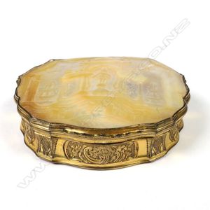 A 19th century mother of pearl and gilt bonbonniere, the top…