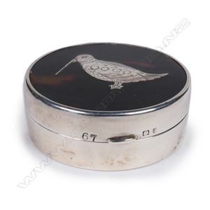 An Edwardian silver and tortoise shell pill box, the tortoise…