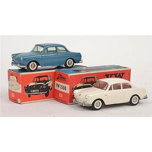 Two Tekno VW 1500 828 models, including one white with red…