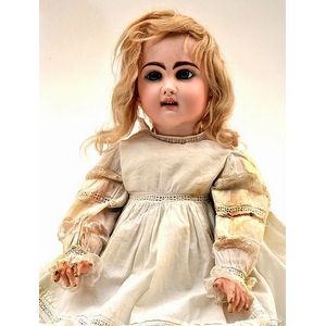 A Henri Rostal Mon Trésor bisque head musical pull-along doll, French circa  1914