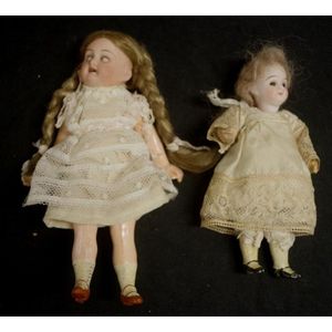Two various antique dressed dolls including a dressed doll with…