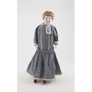 Moulded china head doll all painted features with brown hair,…