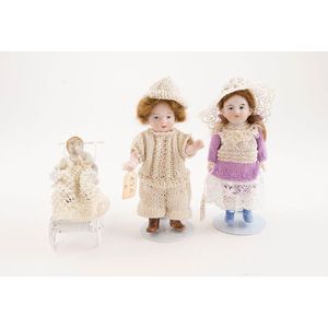 Two all bisque dolls painted features with mohair wigs together…