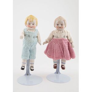 Two Nippon all bisque character dolls boy and girl with moulded…