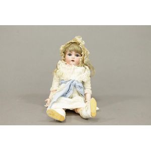 A Simon & Halbig bisque head doll with composition body and…