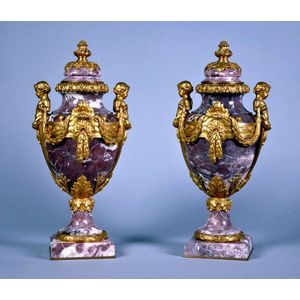 A pair of French ormolu mounted breche violette urns and covers…