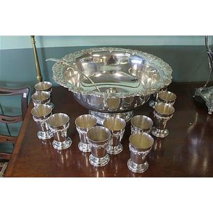 A silver-plate punch set comprising bowl, twelve cups, and ladle