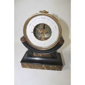 A Victorian brass aneroid barometer, marked Goyon, Paris; the…
