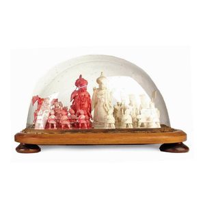 An old Chinese red and plain finely carved ivory chess set,…
