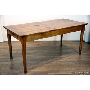 An antique elm farmhouse table, 19th century, the plank top…