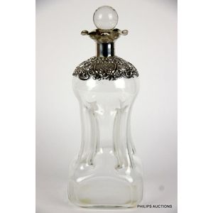 A sterling silver mounted Glug Glug decanter, 1900 Birmingham…