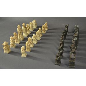 Chinese carved hardstone chess set, dark grey and cream.…