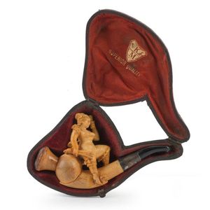 An antique Meerschaum pipe with carved female figure, housed in…
