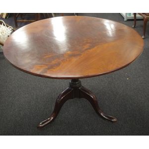 George III mahogany table with round tilt top, on vase stem and…