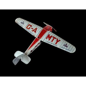 Mettoy 2010 high wing lithograph tinplate monoplane. In…