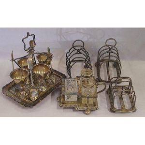 Antique silver plated cruet set together with 3 toast racks and…