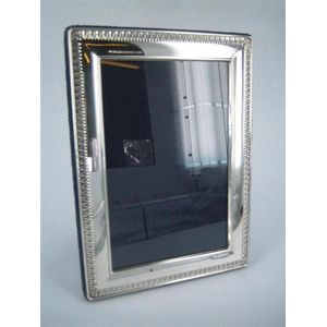 A silver photograph frame with egg and dart border; Whitehill,…