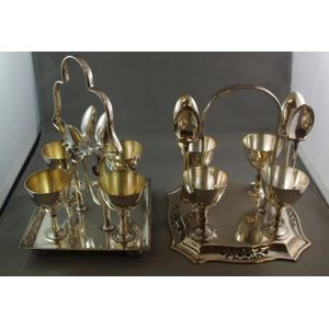 Two EPNS egg cruet sets, both to include 4 egg cups,4 teaspoons…