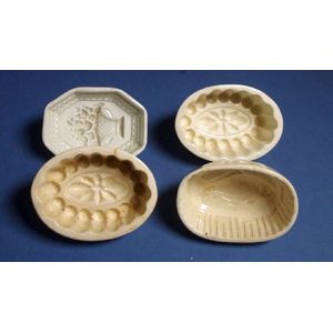 Four antique Spode jelly moulds, one with vase and flowers…