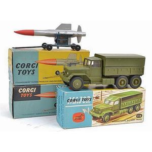 Three Corgi military vehicles, including 1118 International 6X6…