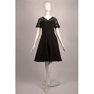 A black lace cocktail dress with sheer short sleeves and&hellip;