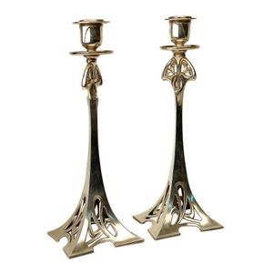 A pair of WMF Art Nouveau silver plated candlesticks, with urn…